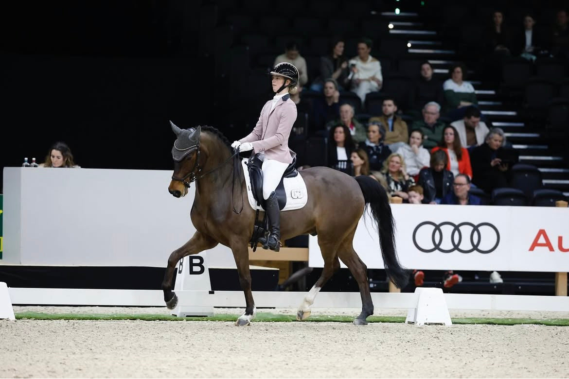 Ainhoa Kuijs competing her bay pony at international show The Dutch Matsers / Indoor Brabant, wearing a JuulC show coat